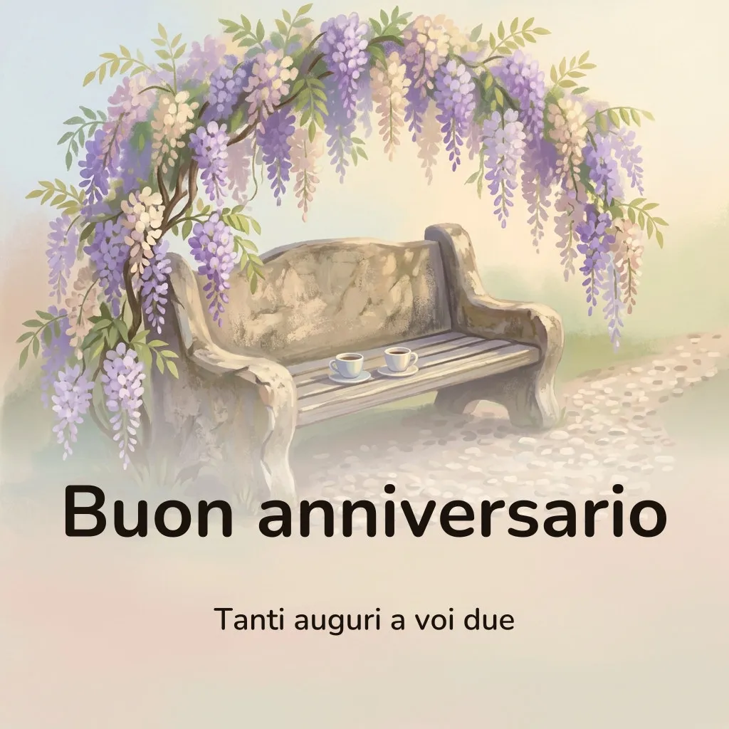 Immagine di buon anniversario: una panchina di pietra sotto un arco di glicine in piena fioritura, con due tazzine da caffè posate una accanto all’altra, con la scritta «Buon anniversario» e «Tanti auguri a voi due»